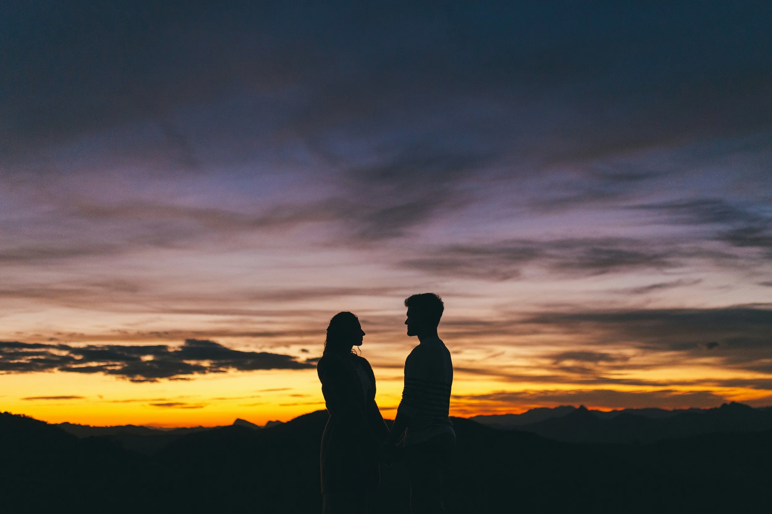 Silhouette of a couple at sunset symbolising shared experiences and meaningful Valentine’s moments