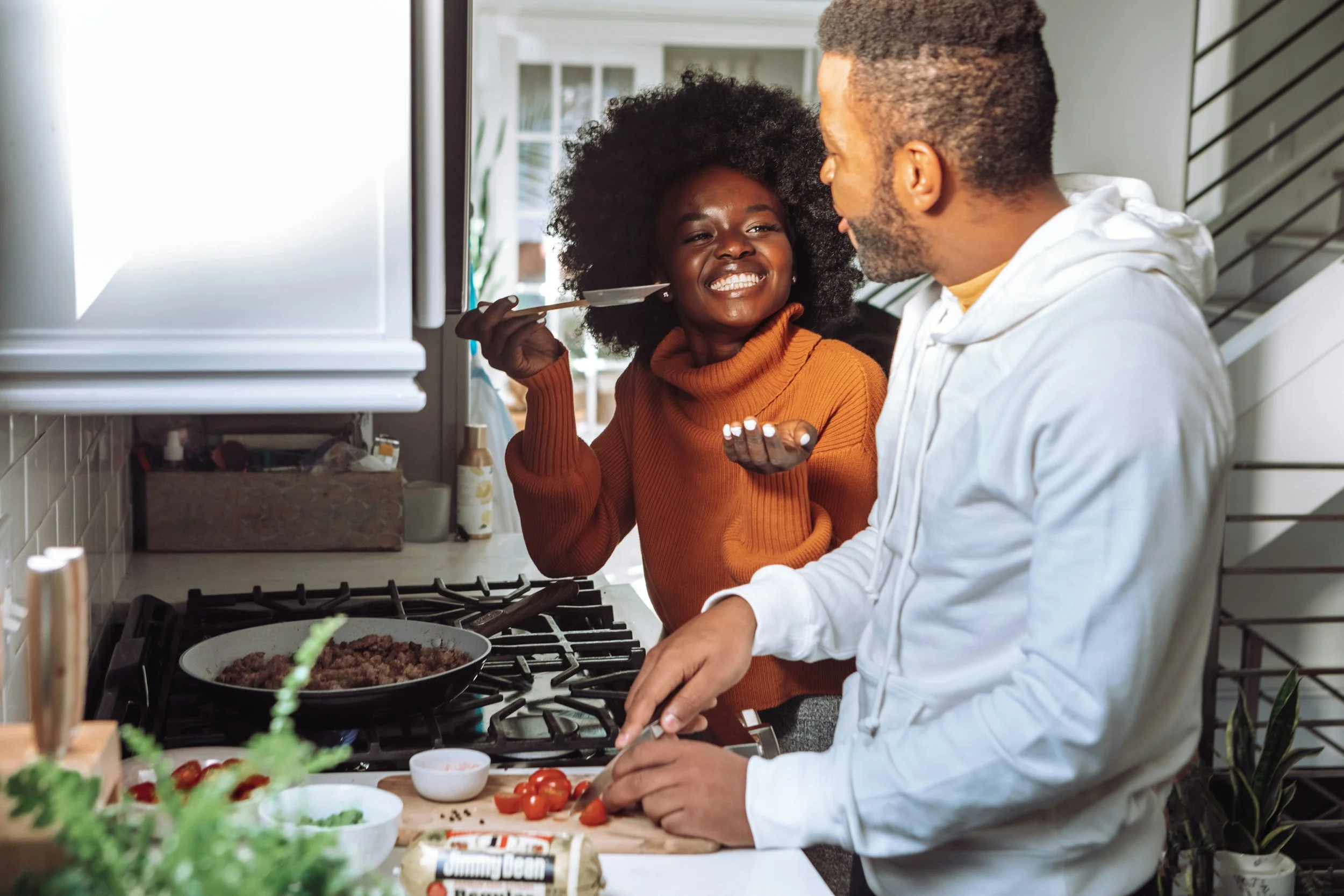 Couple embracing indoors, representing modern Valentine’s Day for couples focused on intimacy over pressure