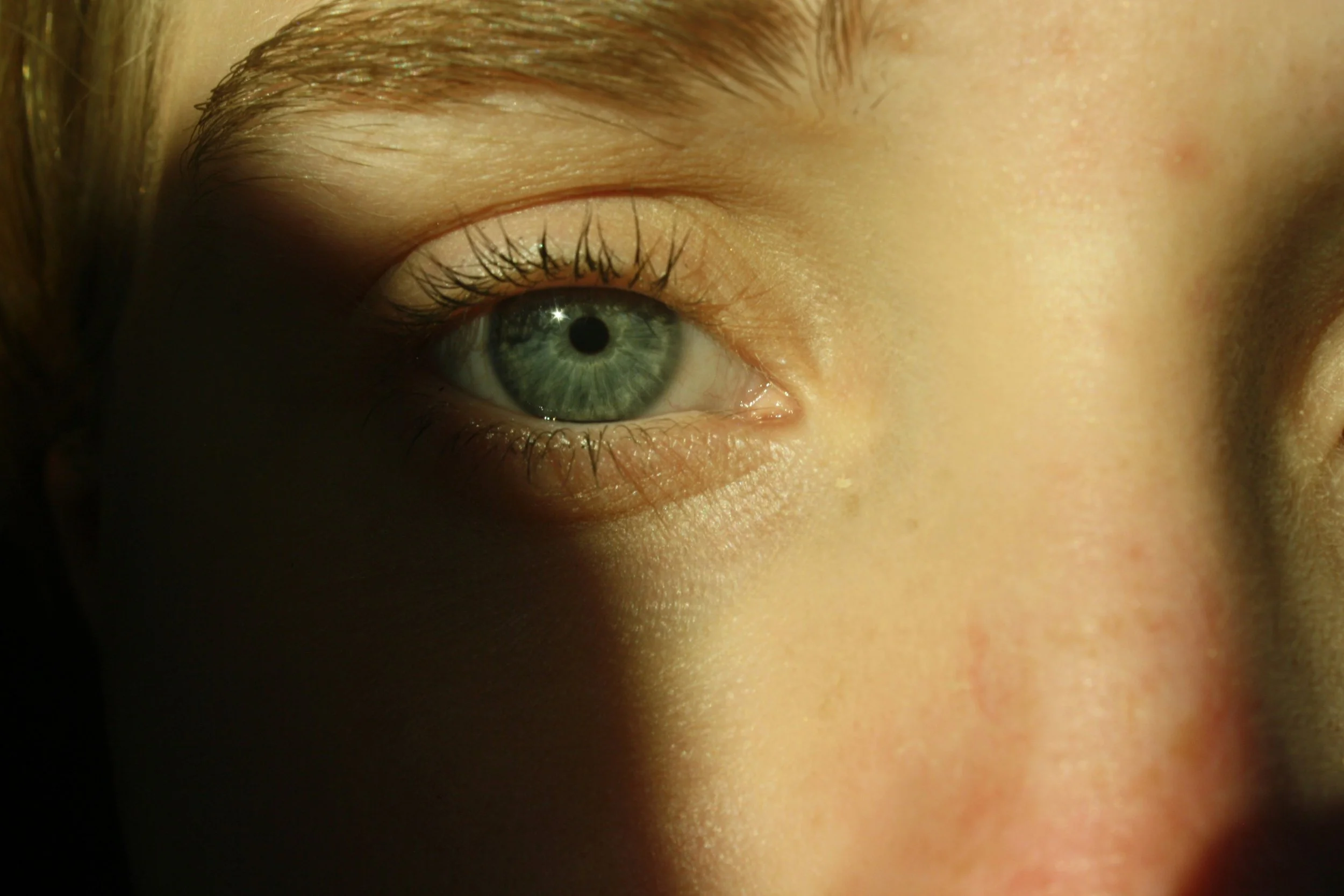 Close-up of an eye, representing psychological perspectives on consent in relationships and self-awareness.