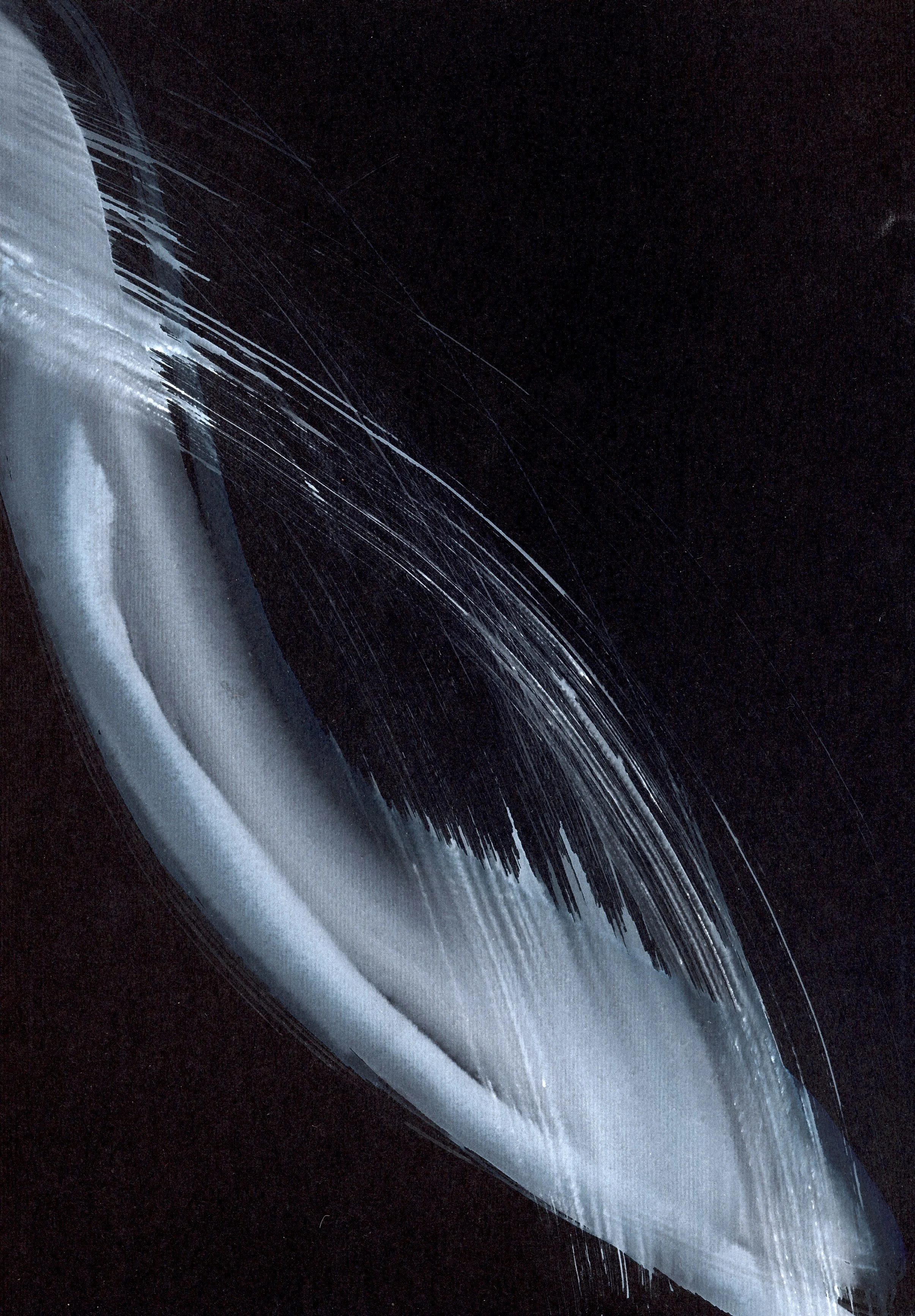 Close-up of a cracked black electronic device, possibly a smartphone or tablet, with visible internal components and scratches.