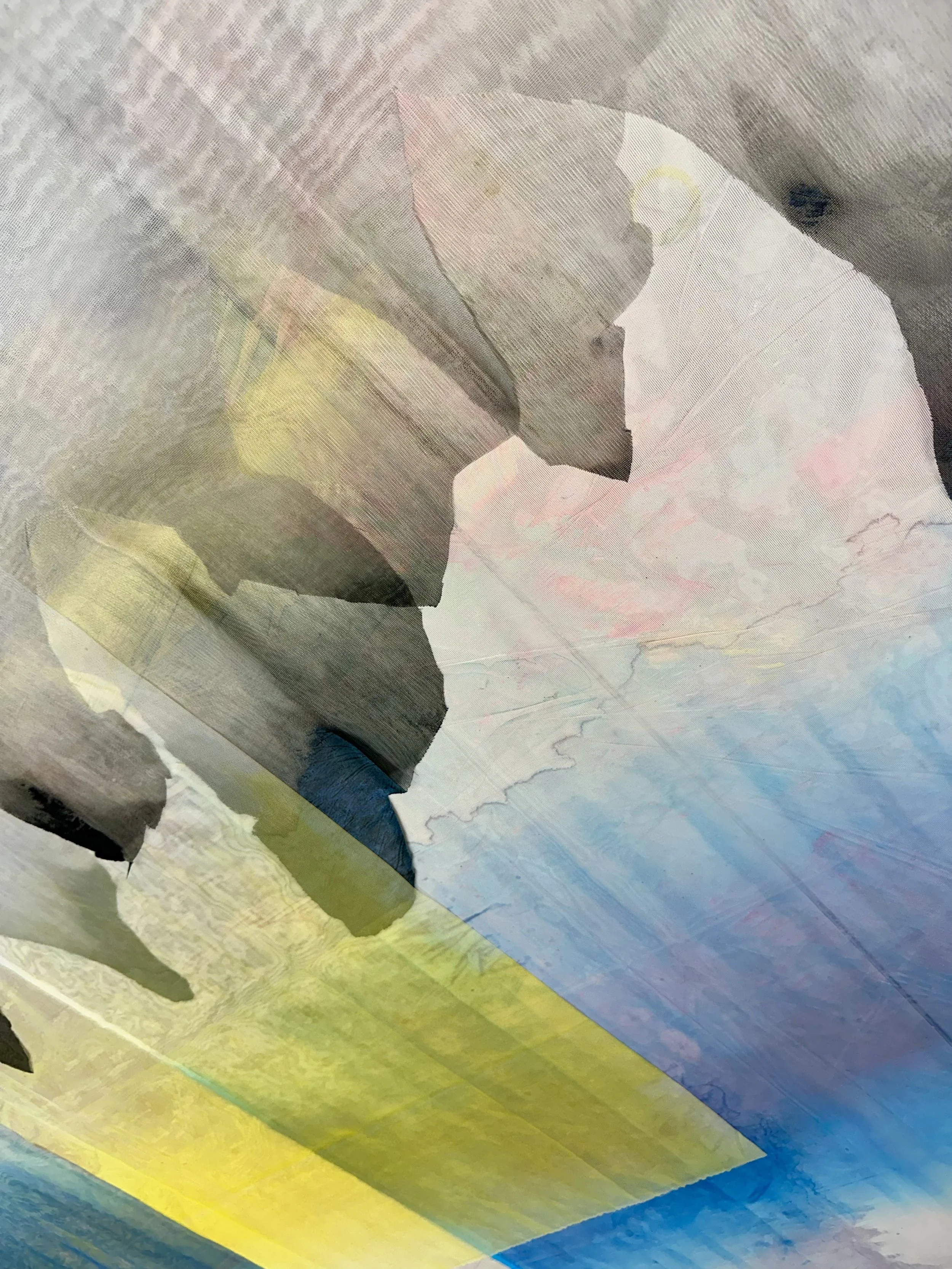 Abstract watercolor painting featuring soft pastel shades of blue, yellow, pink, gray, and green with flowing, blended brushstrokes.