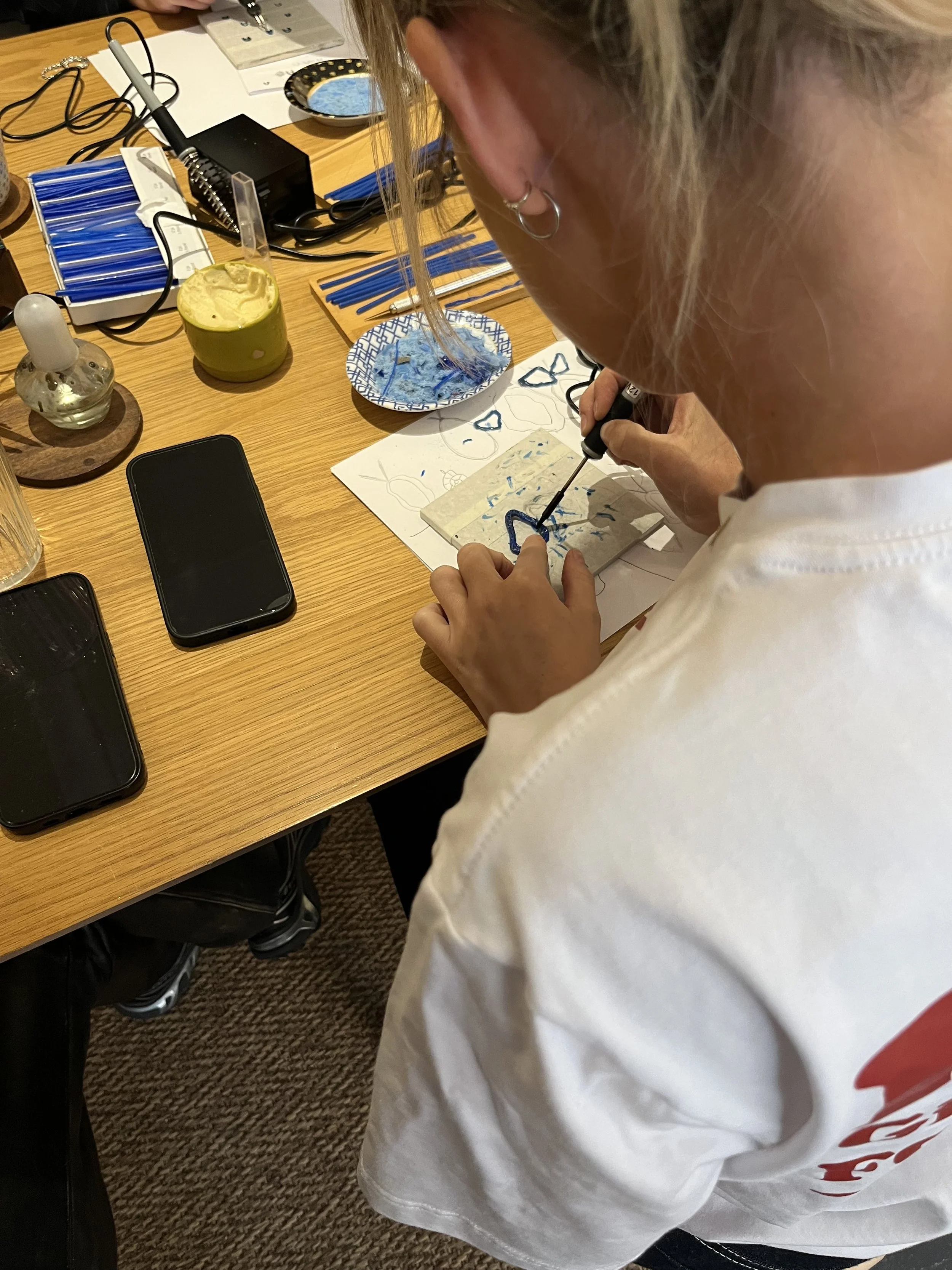 A wax model placed on a wooden mandrel