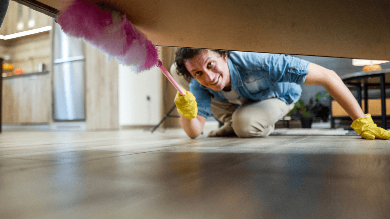 Cleaner vacuuming a hard-to-reach area during a deep cleaning in Yonkers