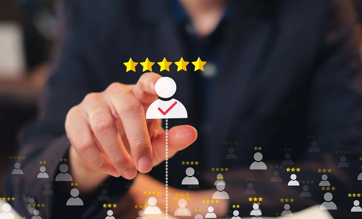 finger/hand selecting 5-star human icon from among lesser icons on imaginary glass wall