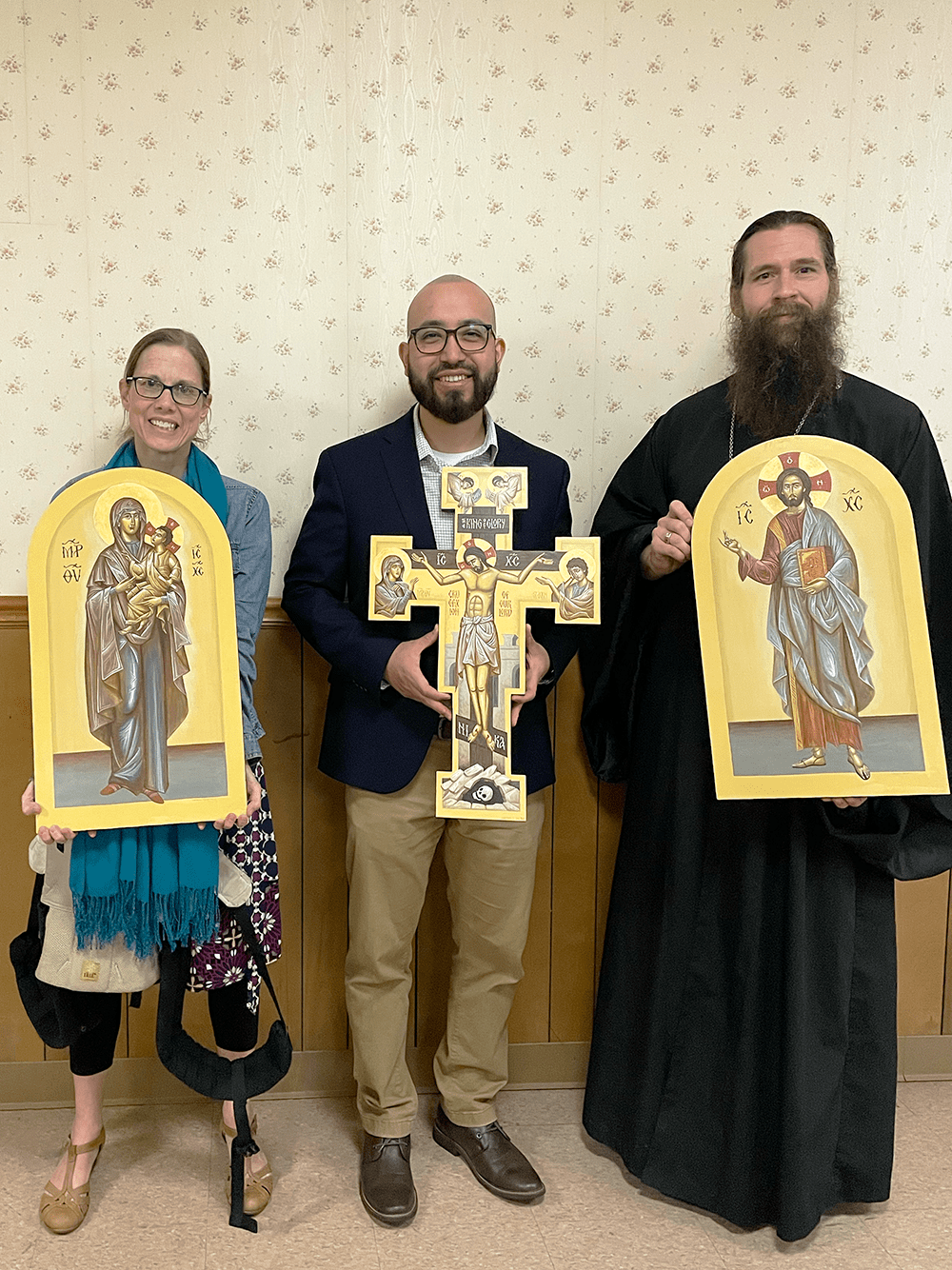Fr. Peter and Kh. Sarah Wingerter receiving icons they commissioned from Kai