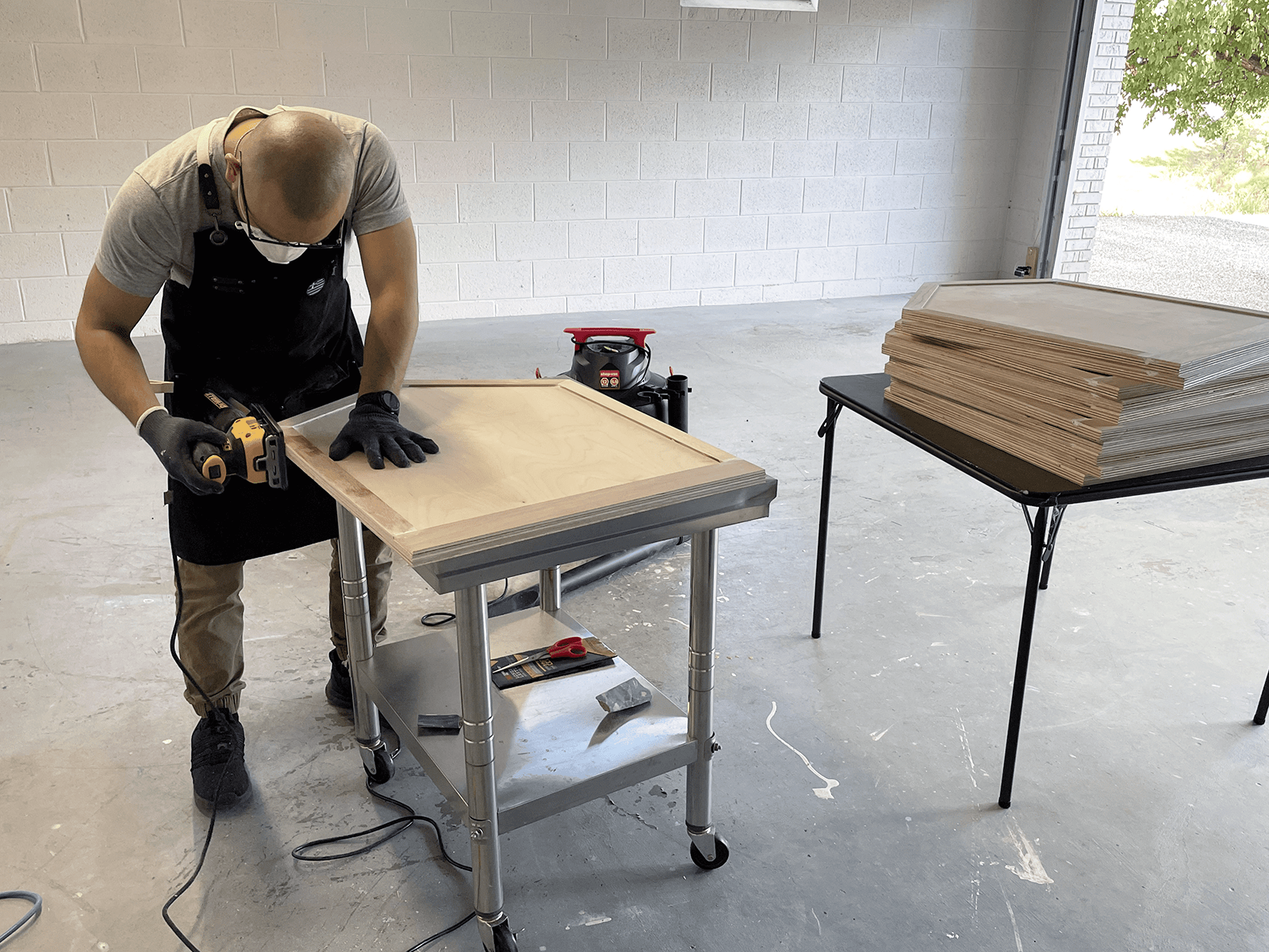 Sanding the borders of the boards, and removing the wood filler