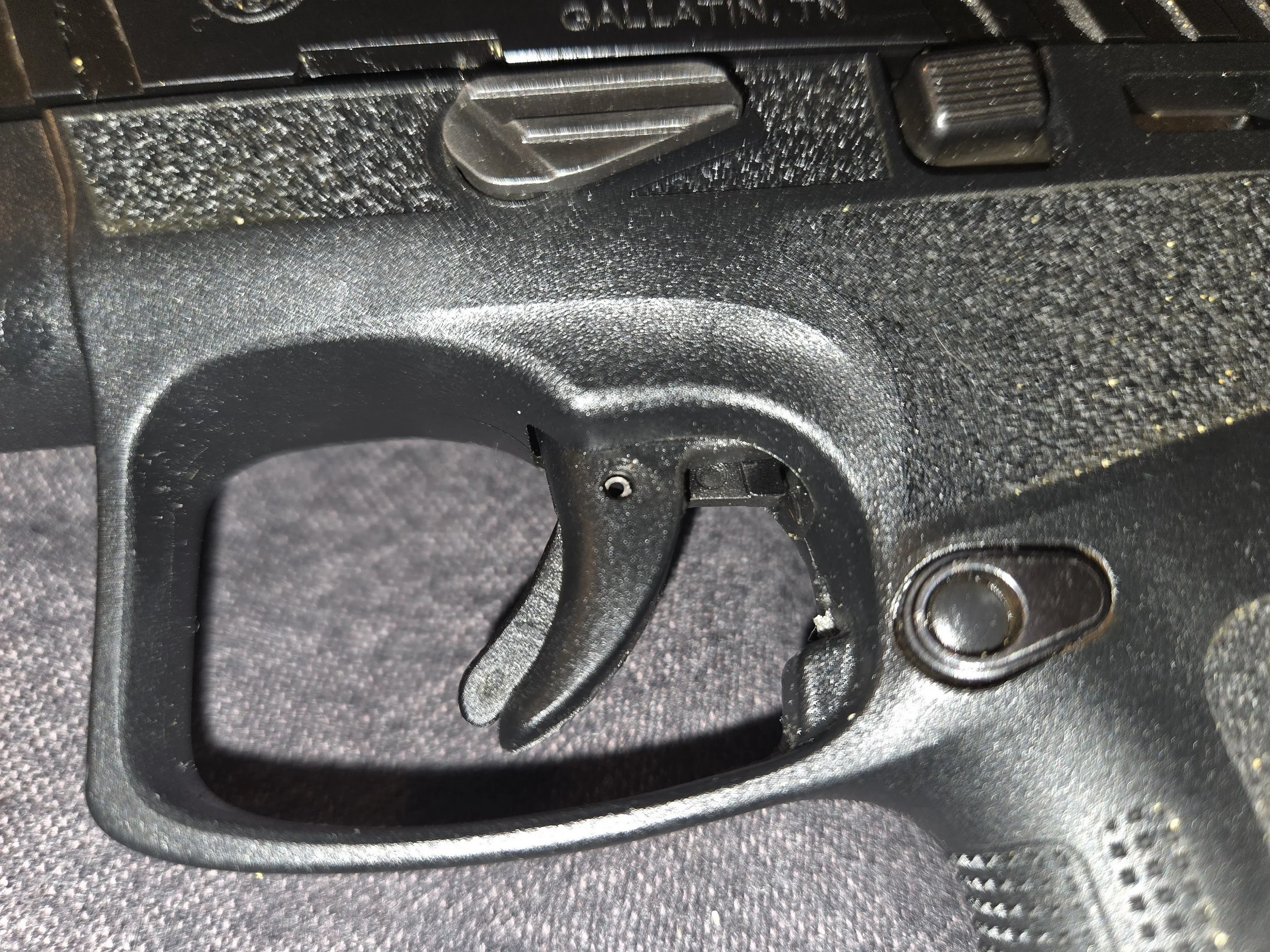Beretta APX A1 Carry micro-compact 9mm pistol in black with aggressive grip texturing, shown with close up of APX Carry DAO trigger