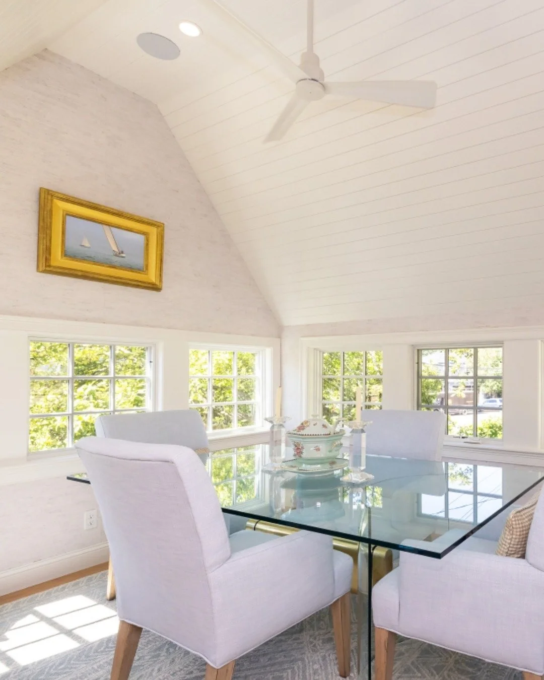 This sun-drenched space is all about natural light and timeless details. From the vaulted ceilings and crisp finishes to the wall of windows that bring the outdoors in, every detail was designed to create a bright and welcoming gathering space.

At S