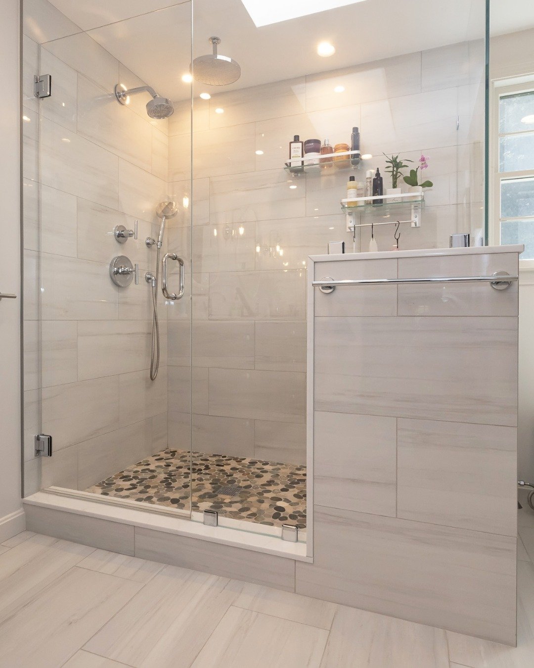 Thoughtful details make all the difference.

From sleek tilework to a custom pebble shower floor, this space was designed for both style and everyday comfort.

#ShepardConstruction #DesignBuild #SouthShoreBuilders #SouthShoreMA