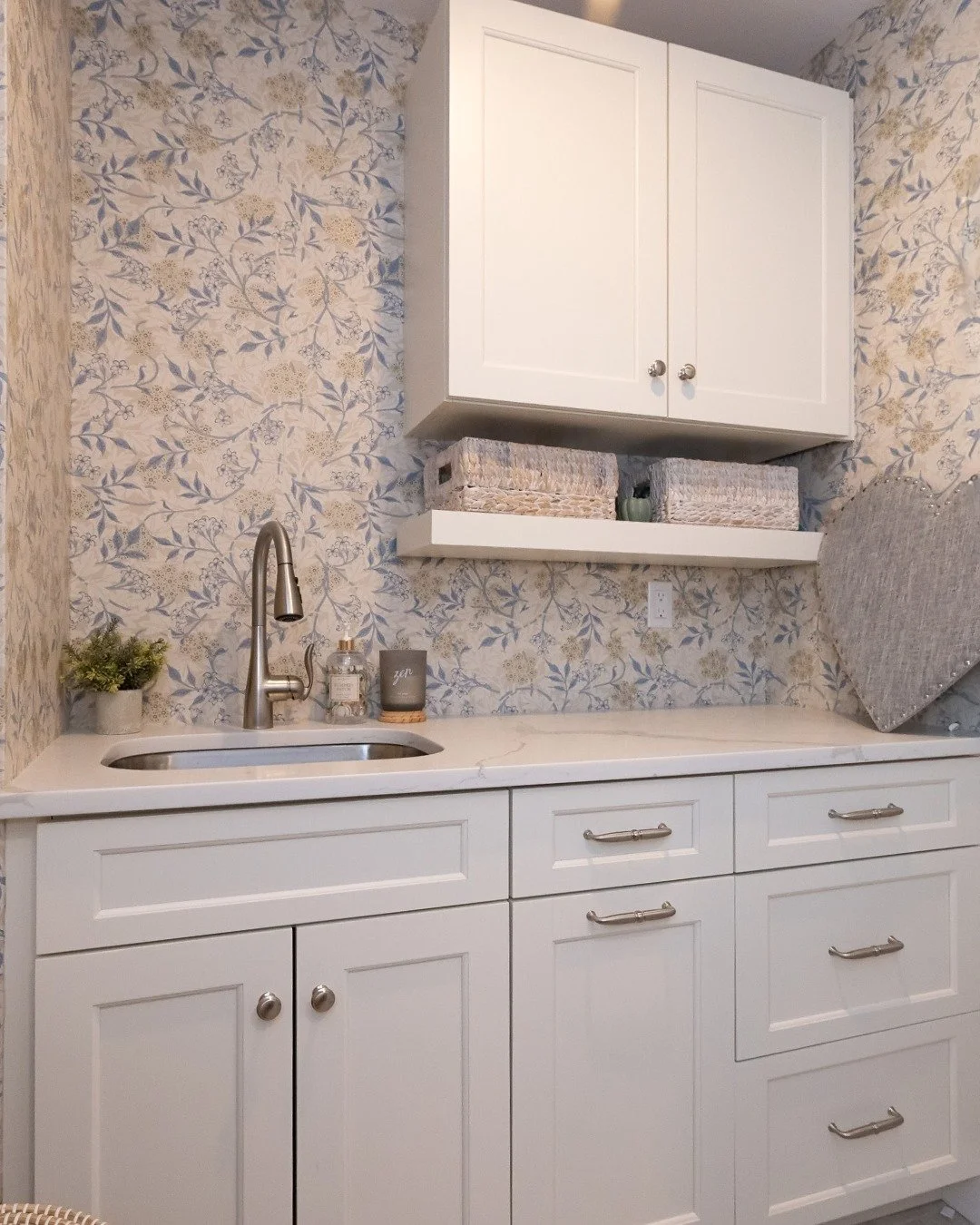 A well-designed laundry room makes everyday tasks easier.

Clean cabinetry, smart storage, and a soft wallpaper detail bring this space together.

#ShepardConstruction #DesignBuild #BuiltByShepard #SouthShoreBuilders #SouthShoreMA