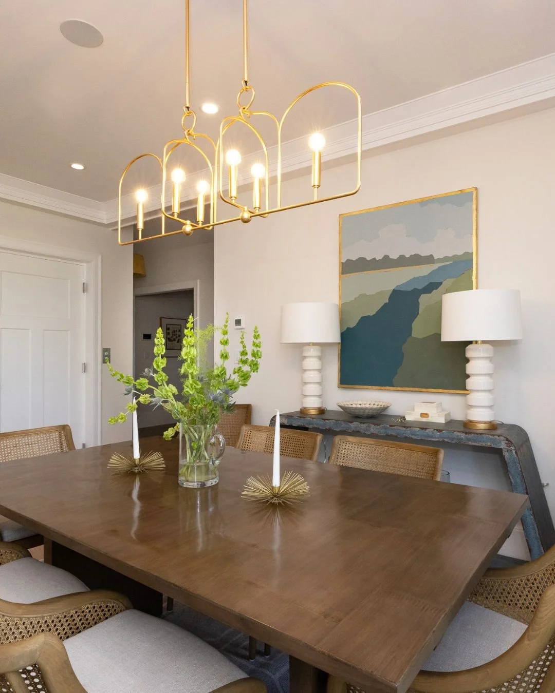 Where craftsmanship meets everyday gathering. ✨

This dining space combines warm hardwood floors, custom trim details, and statement lighting to create a room that feels both elevated and inviting. Thoughtful design, balanced textures, and timeless f