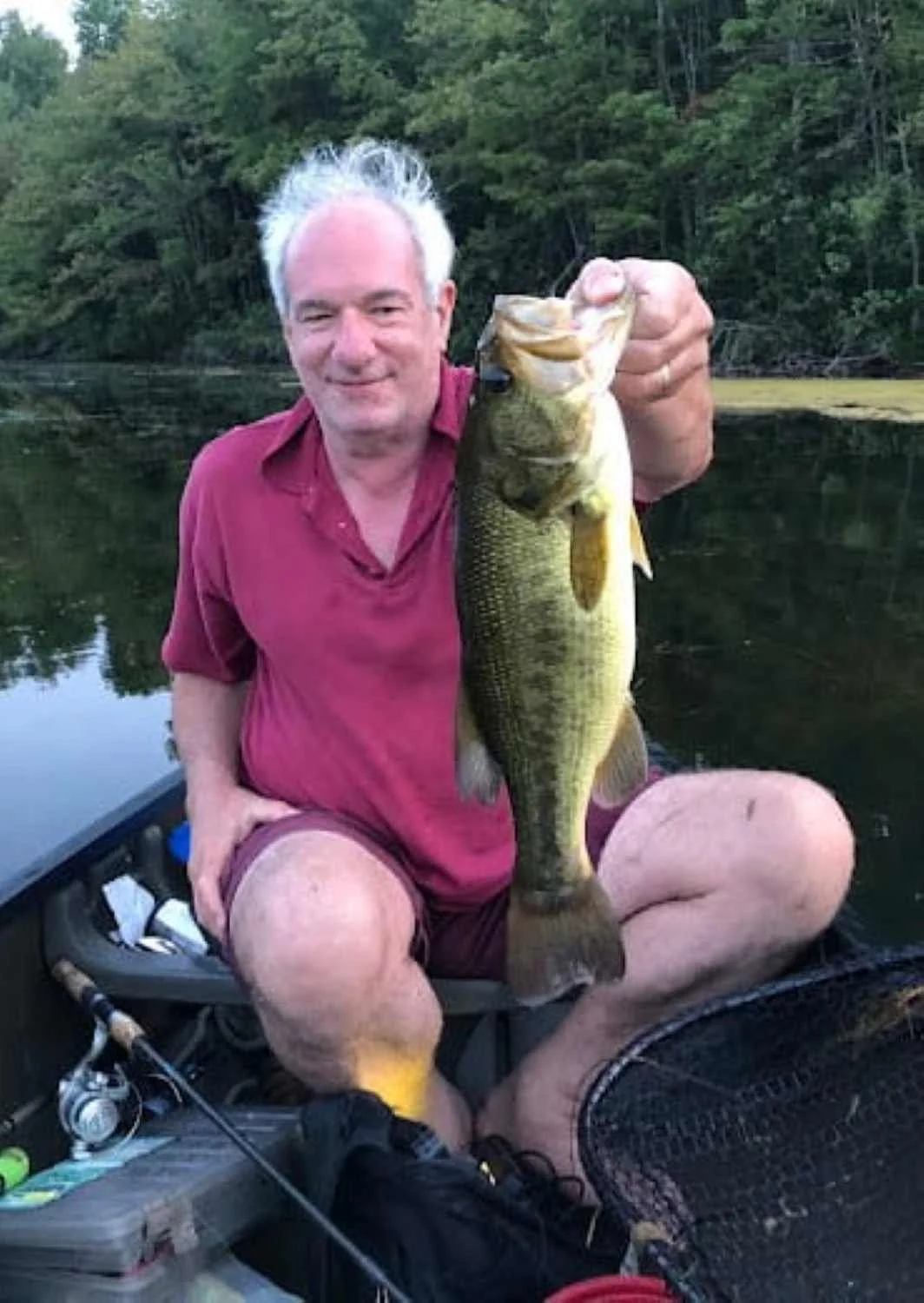 A large bass caught on a weedless frog.