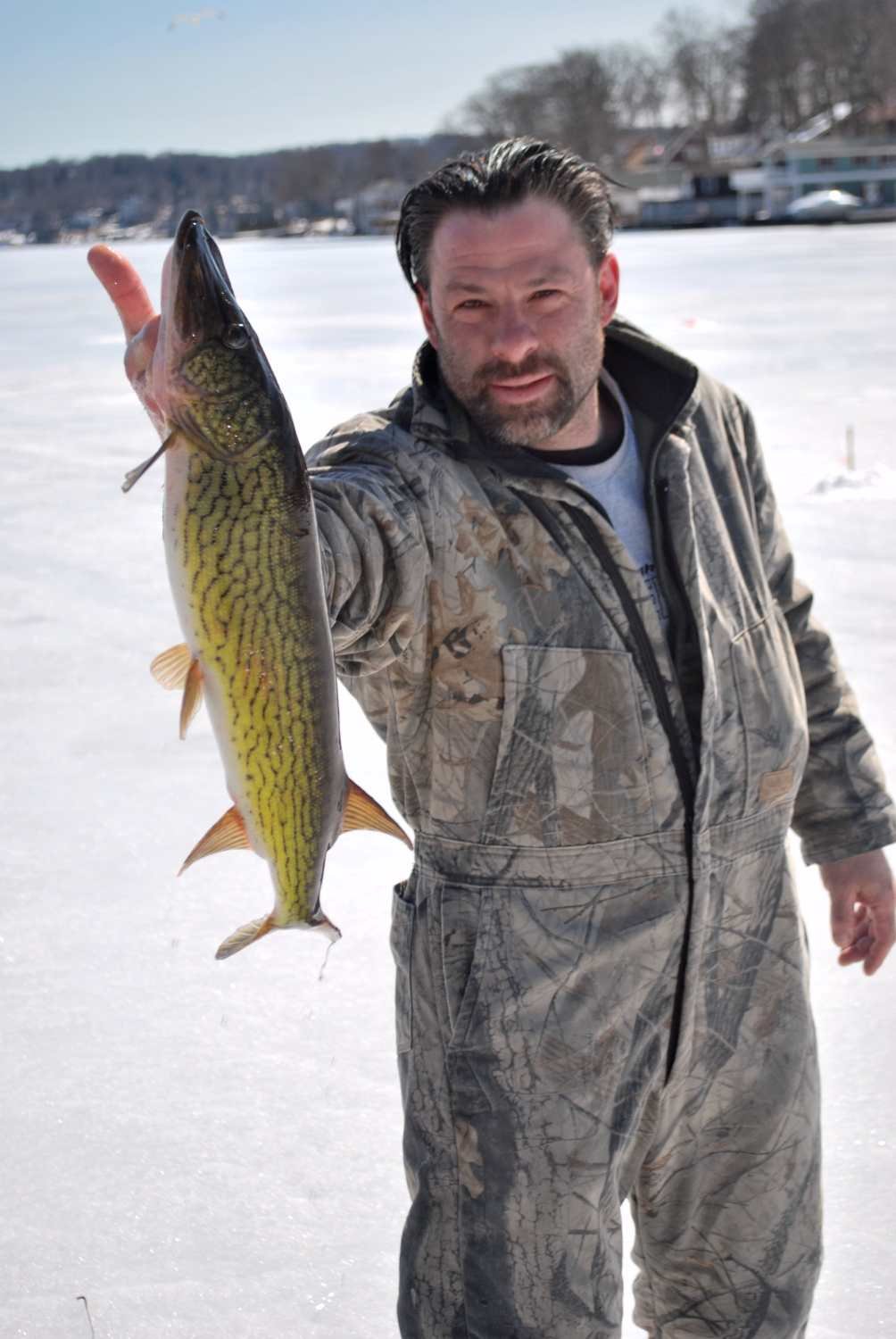 Joe Landolfi with a nice sized pickerel from relatively shallow water.