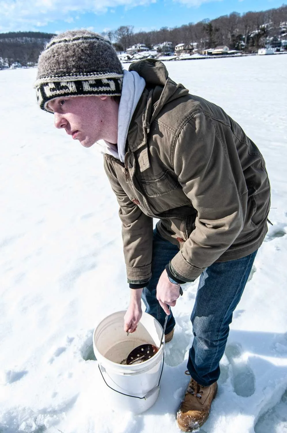 A friend of my son, Will, gathers a shiner from the bait bucket.