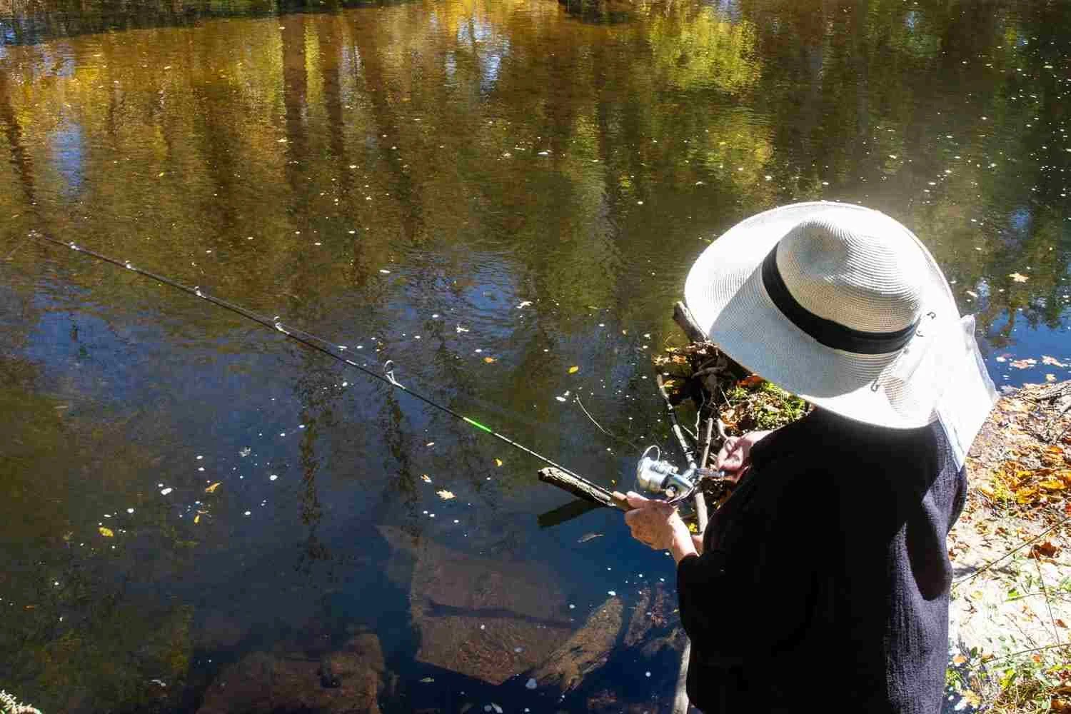 Fisherwoman wearing a white hat.