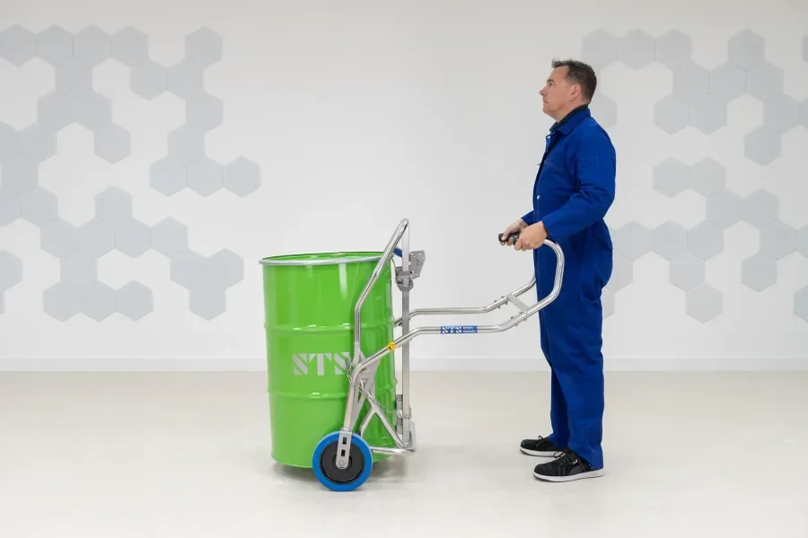 person demonstrating a drum truck that is holding a 55 gallon plastic drum