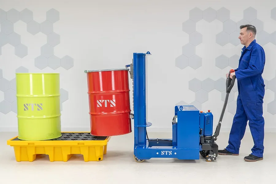 Operator lifting a steel drum off a pallet