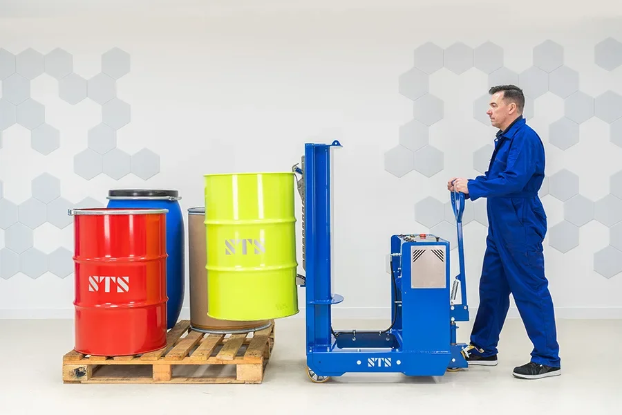 Operator lifting a steel drum off a pallet