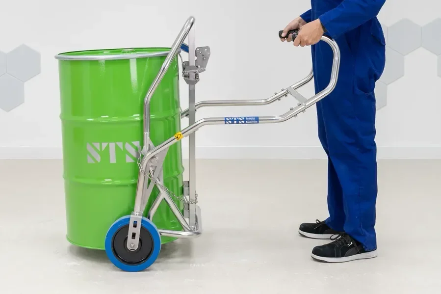 person moving a drum with the drum truc