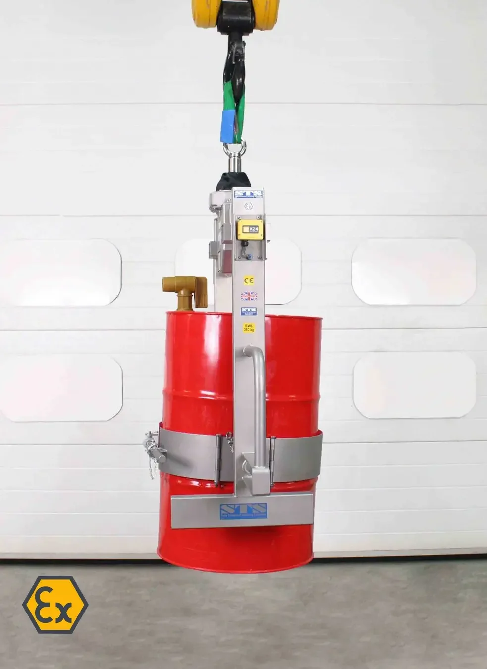 image of the equipment holding a red 55 gallon steel drum demonstrating it's save for zoned areas