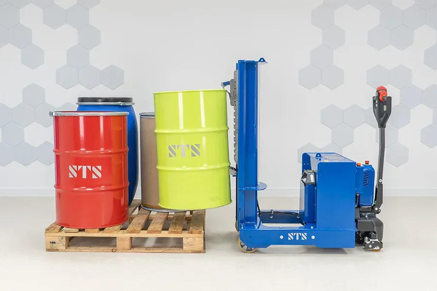 Counterbalance drum lifter pucking up a 55 gallon steel drum from a pallet