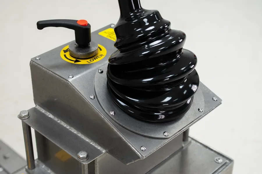 Stainless Steel drum lifter with detail image of the waterproof booted manual hand pump