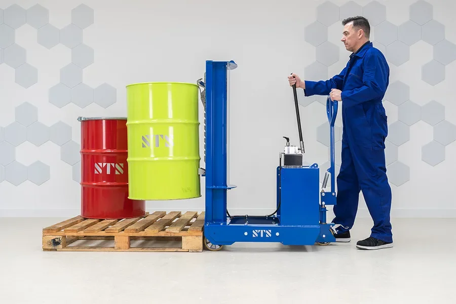 Operator lifting a steel drum off a pallet