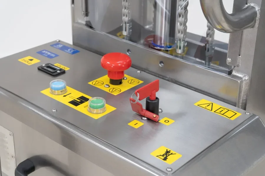 Counterbalance drum lifter placing a drum on a  containment pallet