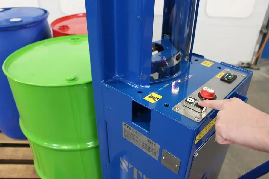detail image of the push button electric hydraulic lift attached to the drum lifter