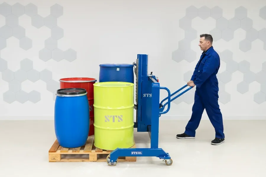 operator safely using a side shift drum lifter to remove a plastic barrel from a pallet