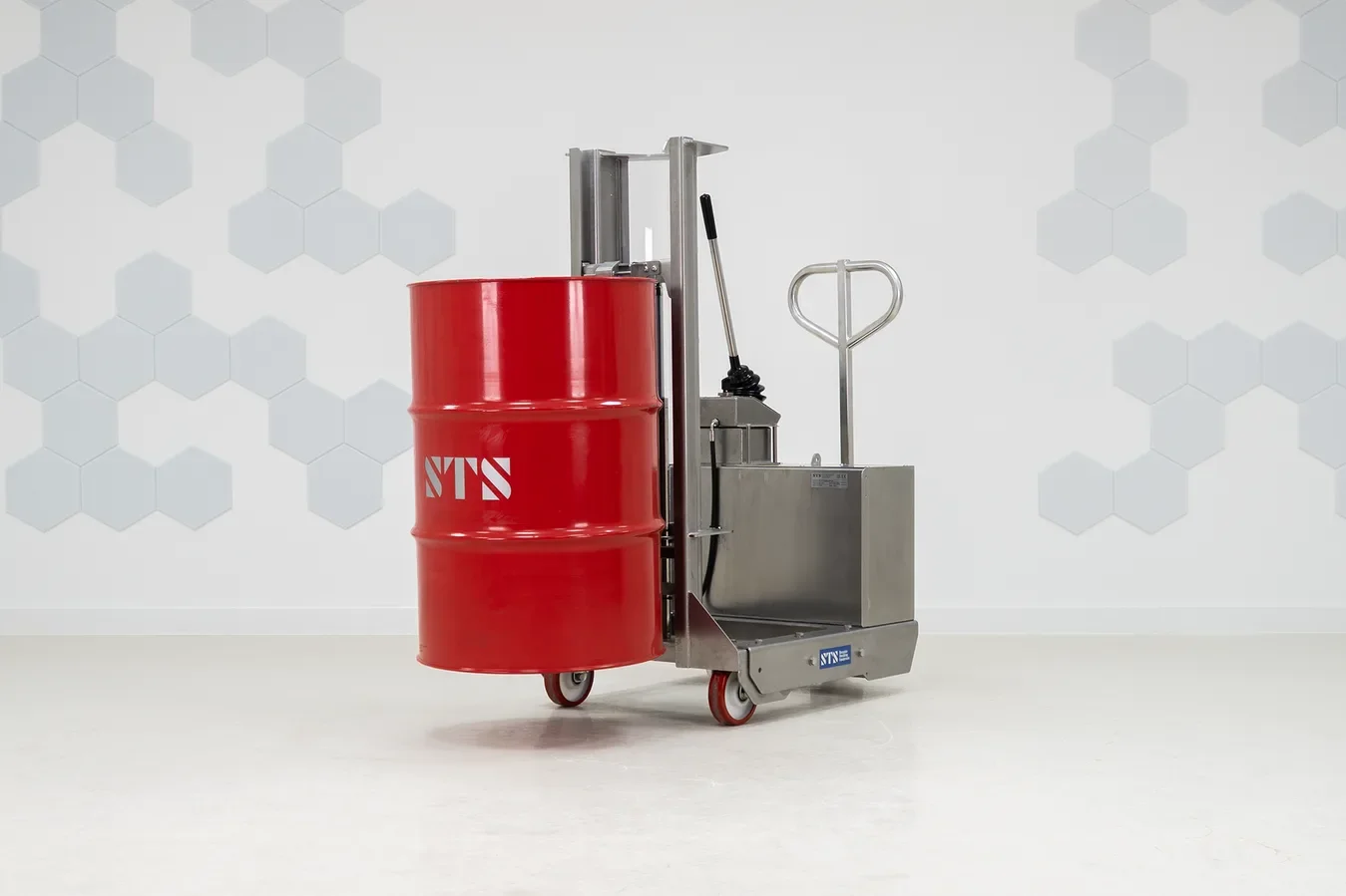 red 55 gallon steel drum being held by a stainless steel drum lifter