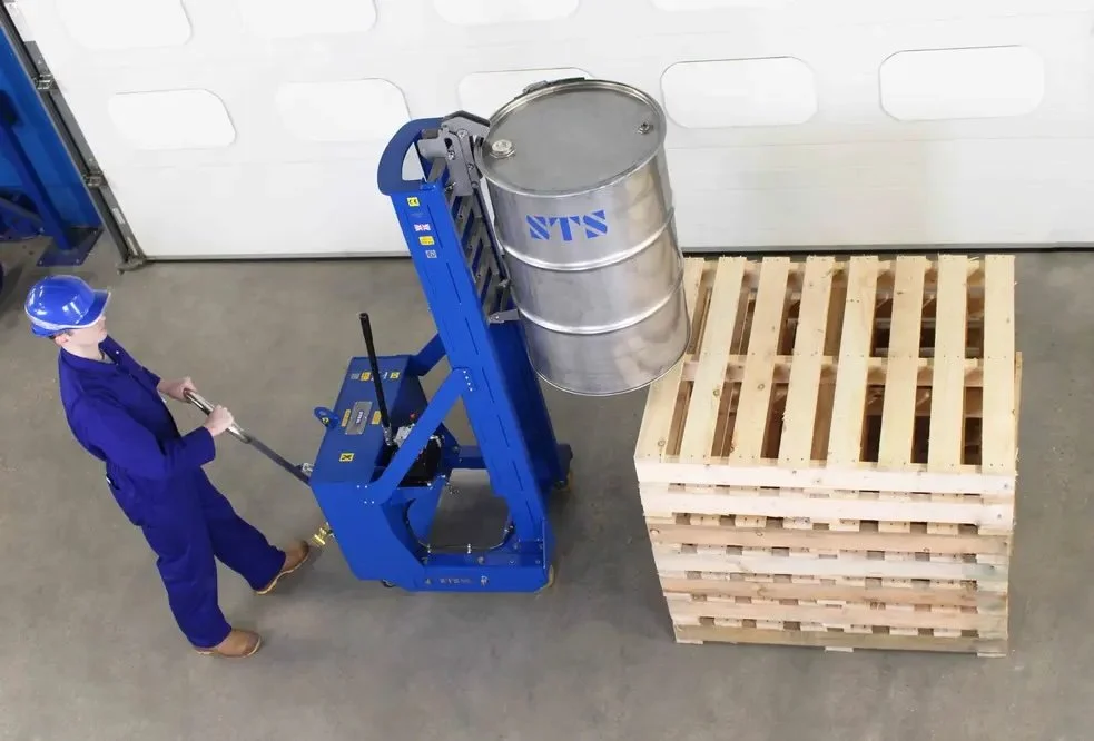 image of an operator steering the manual the drum stacker with the rear wheel