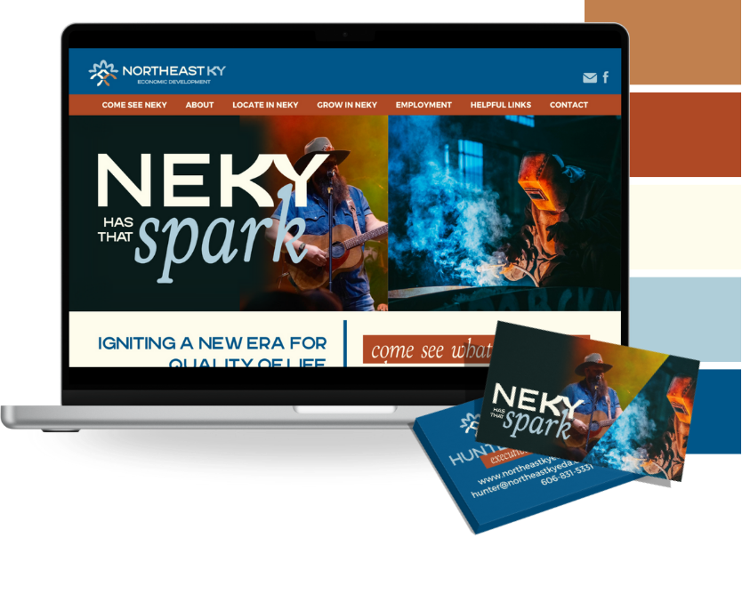 A laptop displaying the Northeast Kentucky economic development website, with a banner featuring a musician and a welder. In front of the laptop are business cards with the same design and contact information.