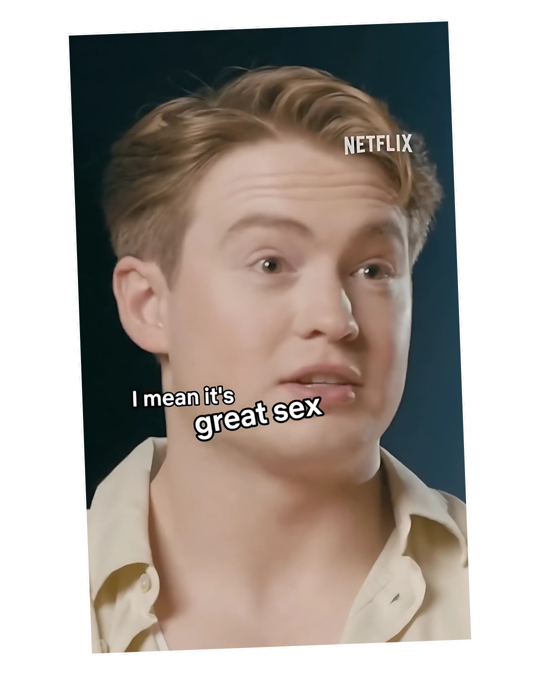A young person with short, light brown hair speaking during a Netflix interview, with text overlay saying 'I mean it's great sex'.