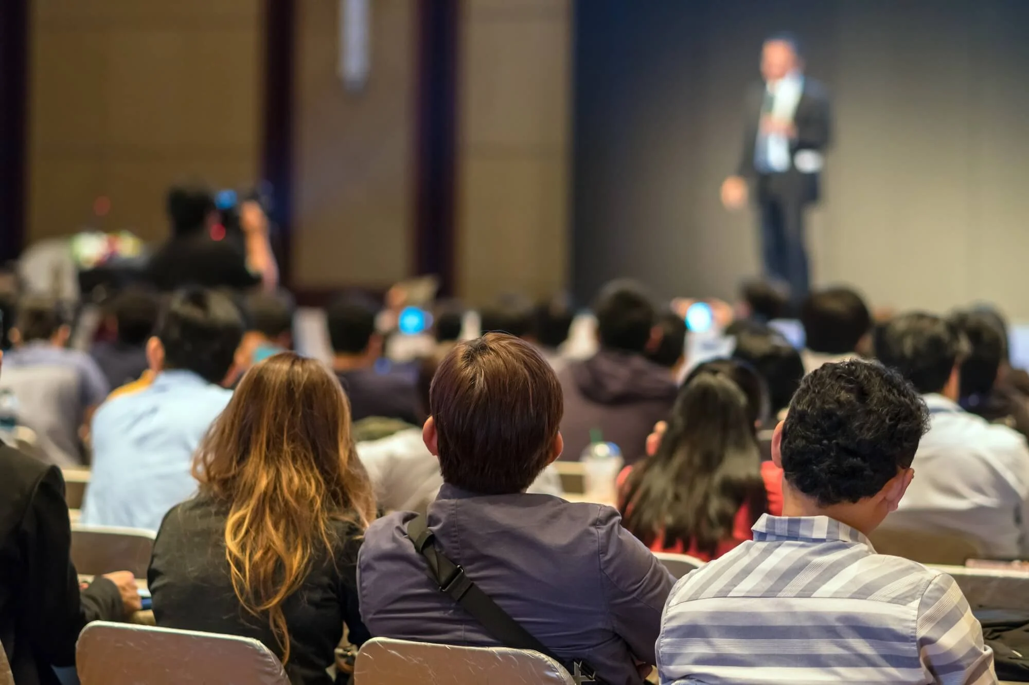 rear-side-of-audiences-sitting-and-listening-the-s-2026-03-10-03-13-04-utc (1).jpg