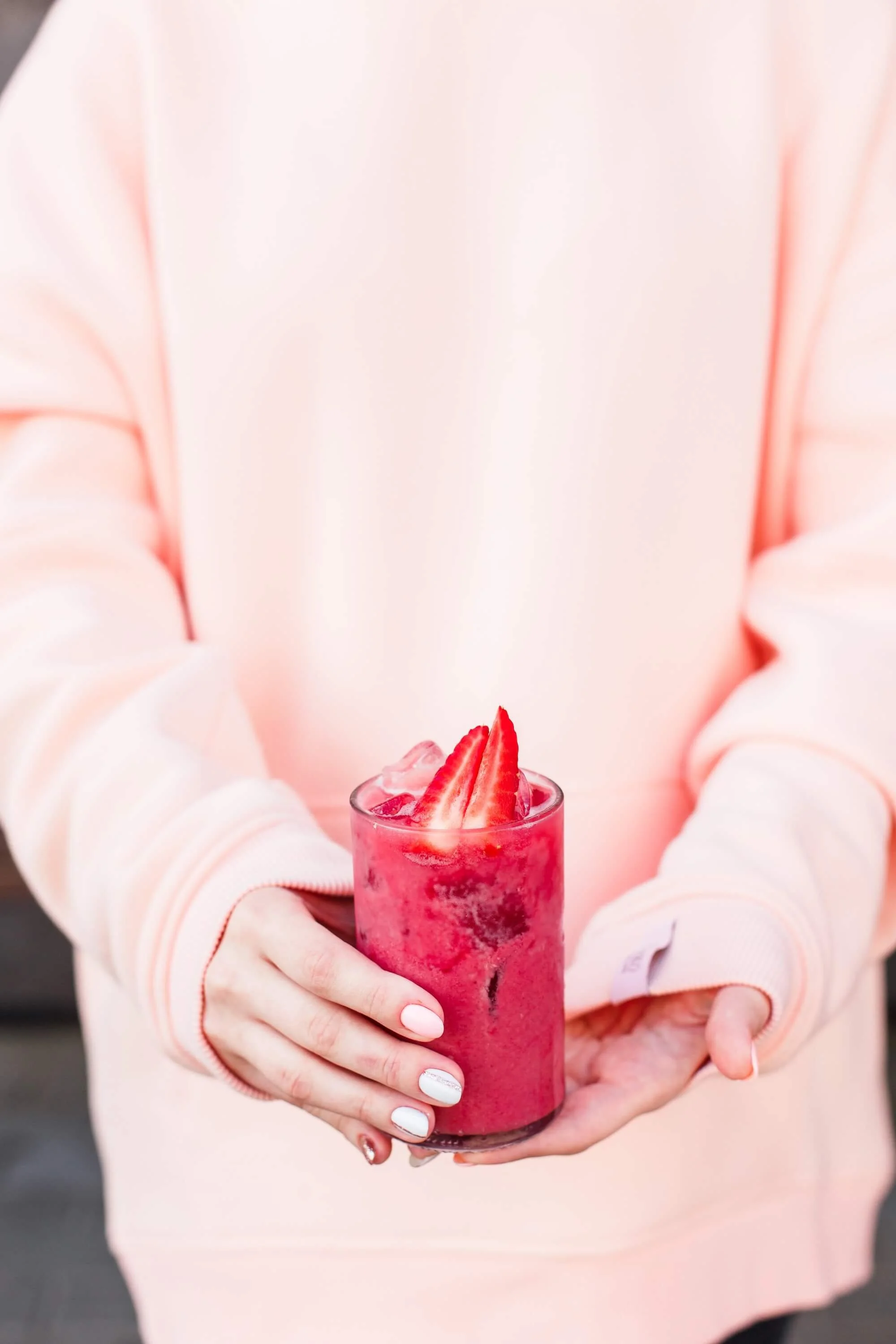 woman-in-a-pink-hoodie-holding-a-highball-glass-wi-2026-01-06-10-55-39-utc (1).jpg