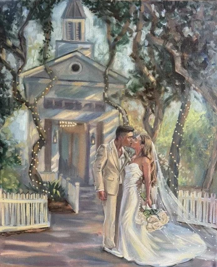 Painting of a bride and groom kissing in front of a church, with trees and string lights in the background.