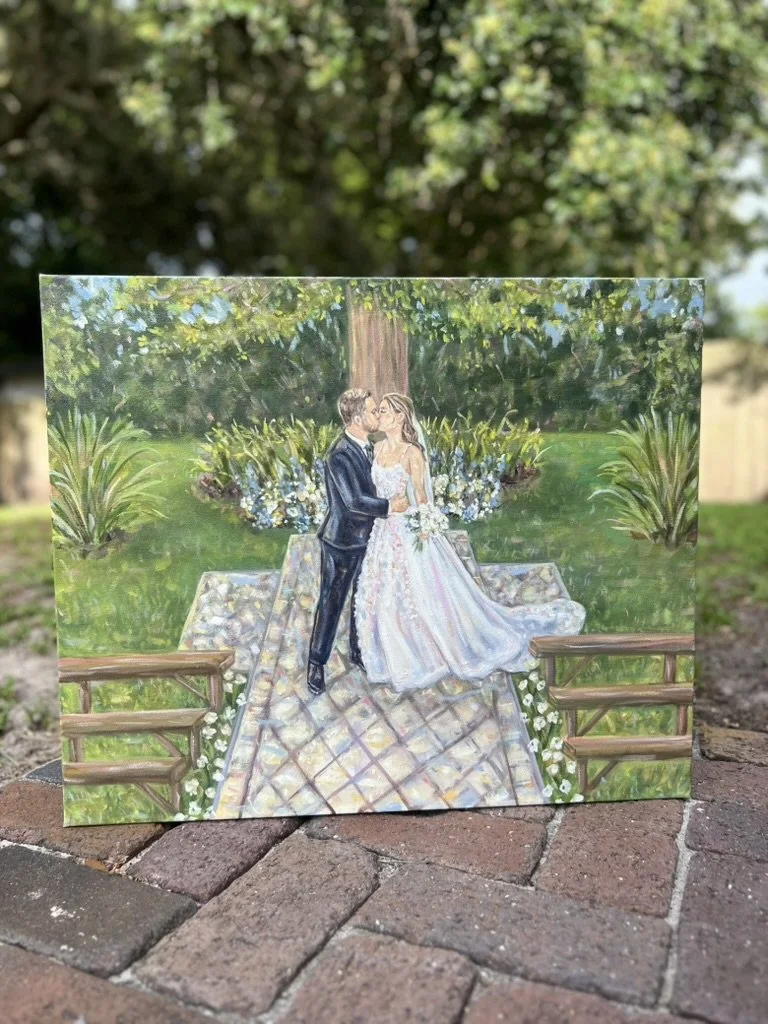 A painting of a wedding scene showing a bride and groom kissing outdoors, with lush greenery, trees, and flowers in the background.