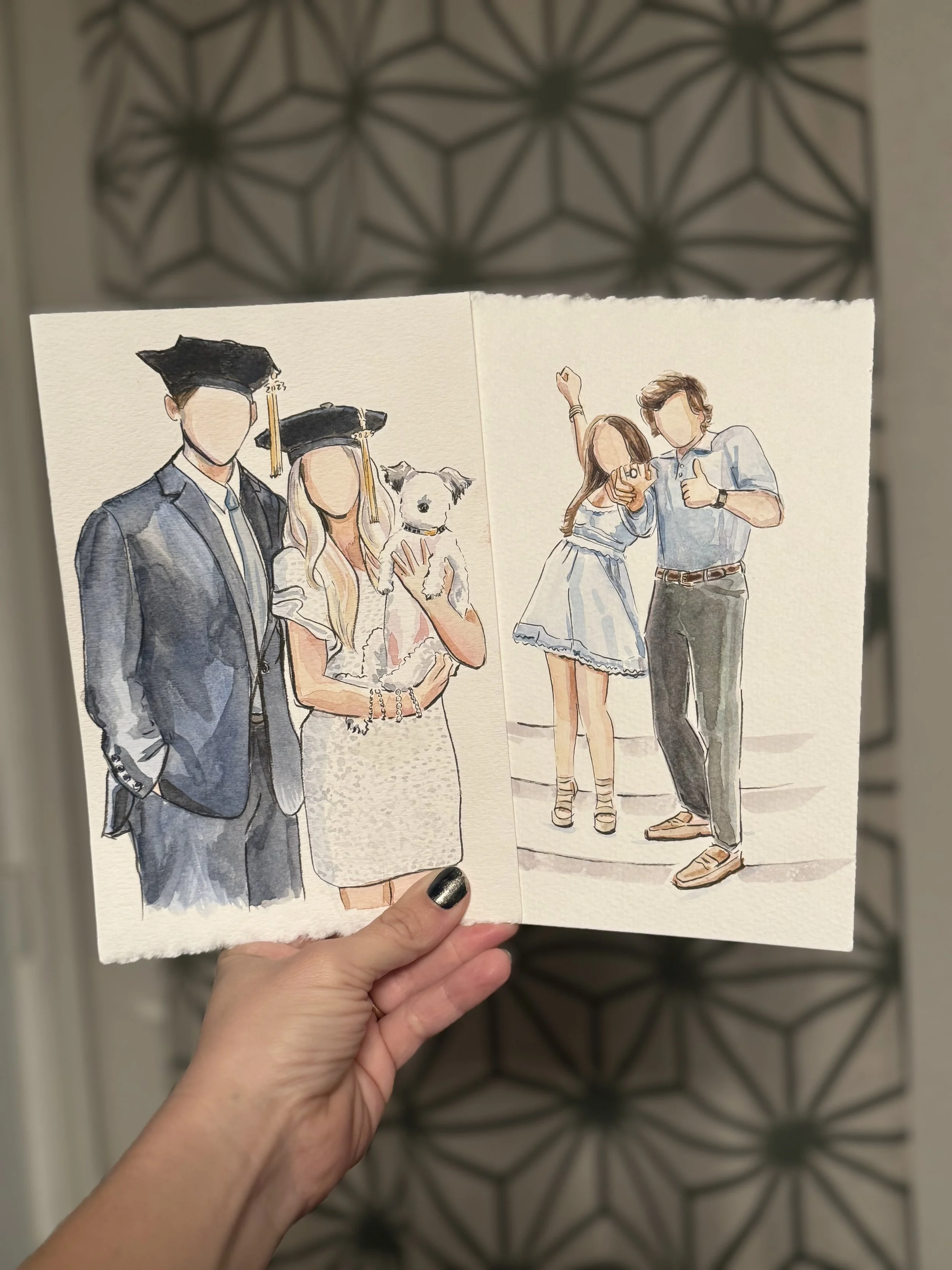 Hand holding a watercolor illustration of two groups of people, part of a graduation celebration. The left side shows a graduate in a cap and gown with a woman and a small dog. The right side depicts a woman and a man taking a selfie together.