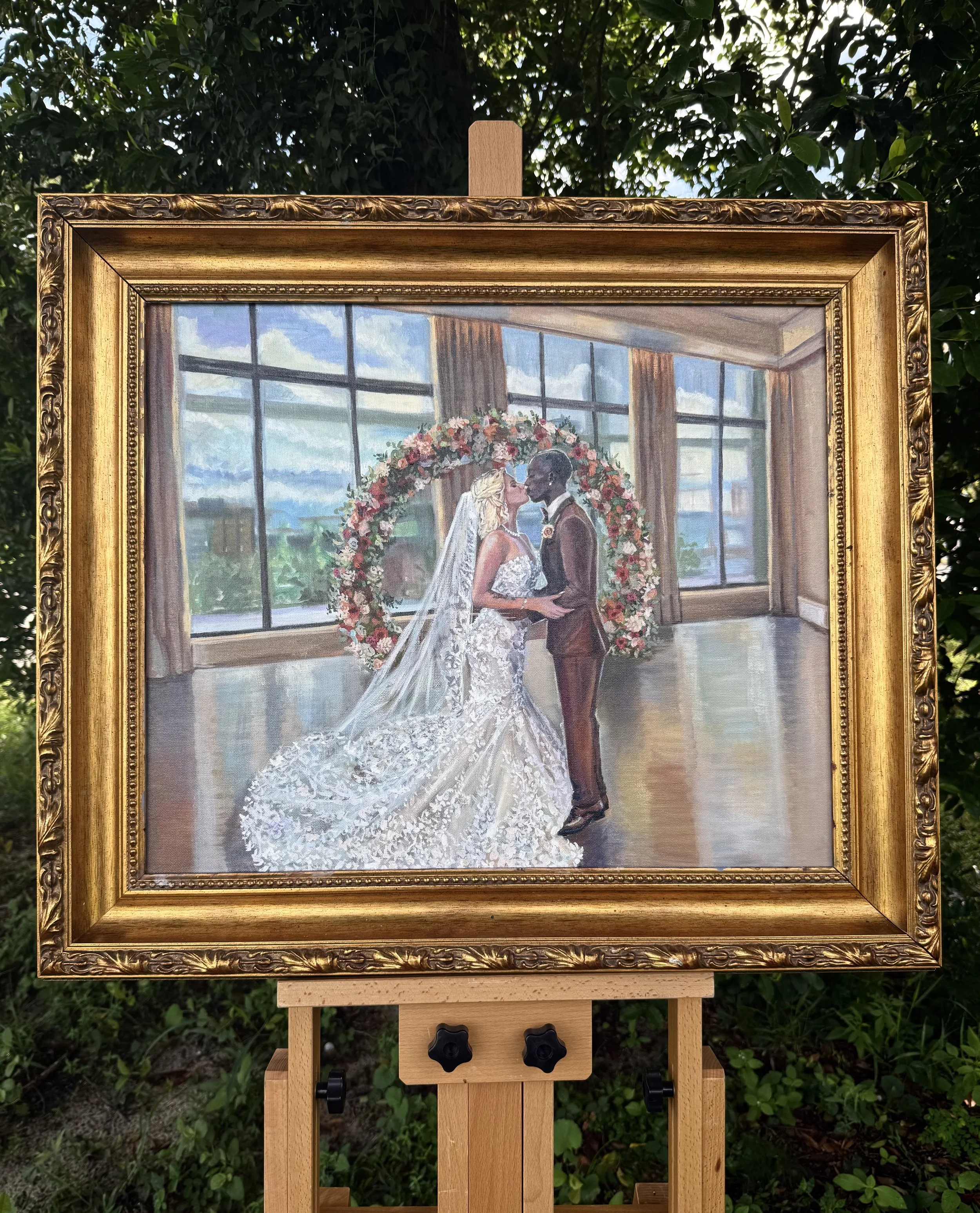 Painting of a bride and groom standing in a ballroom with large windows and a floral wedding arch, kissing on their wedding day.