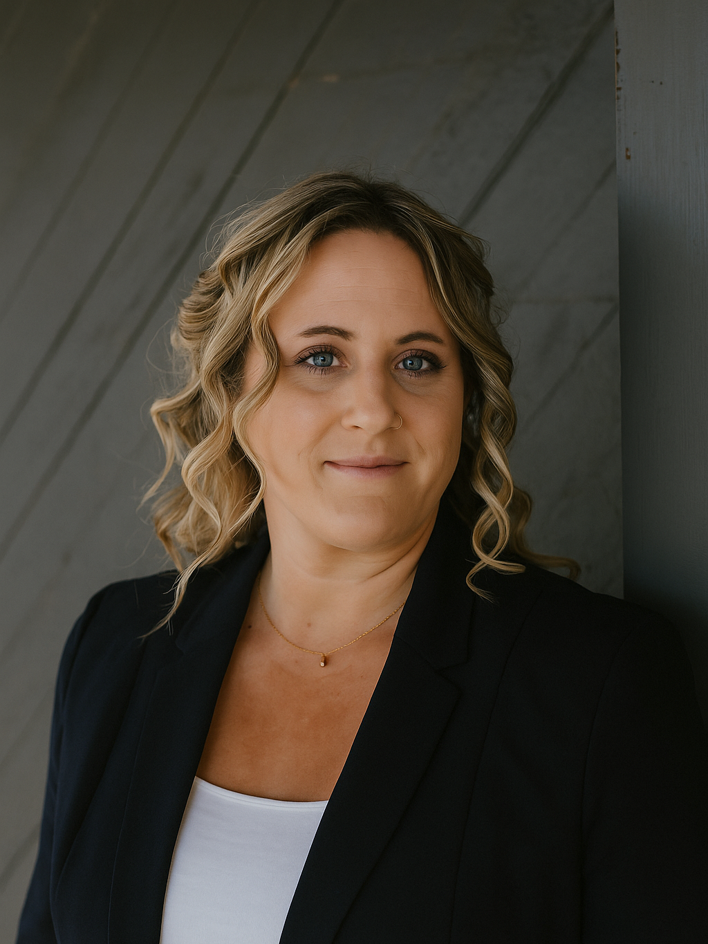 A generic grayscale user profile icon with a silhouette of a person on a circular background.