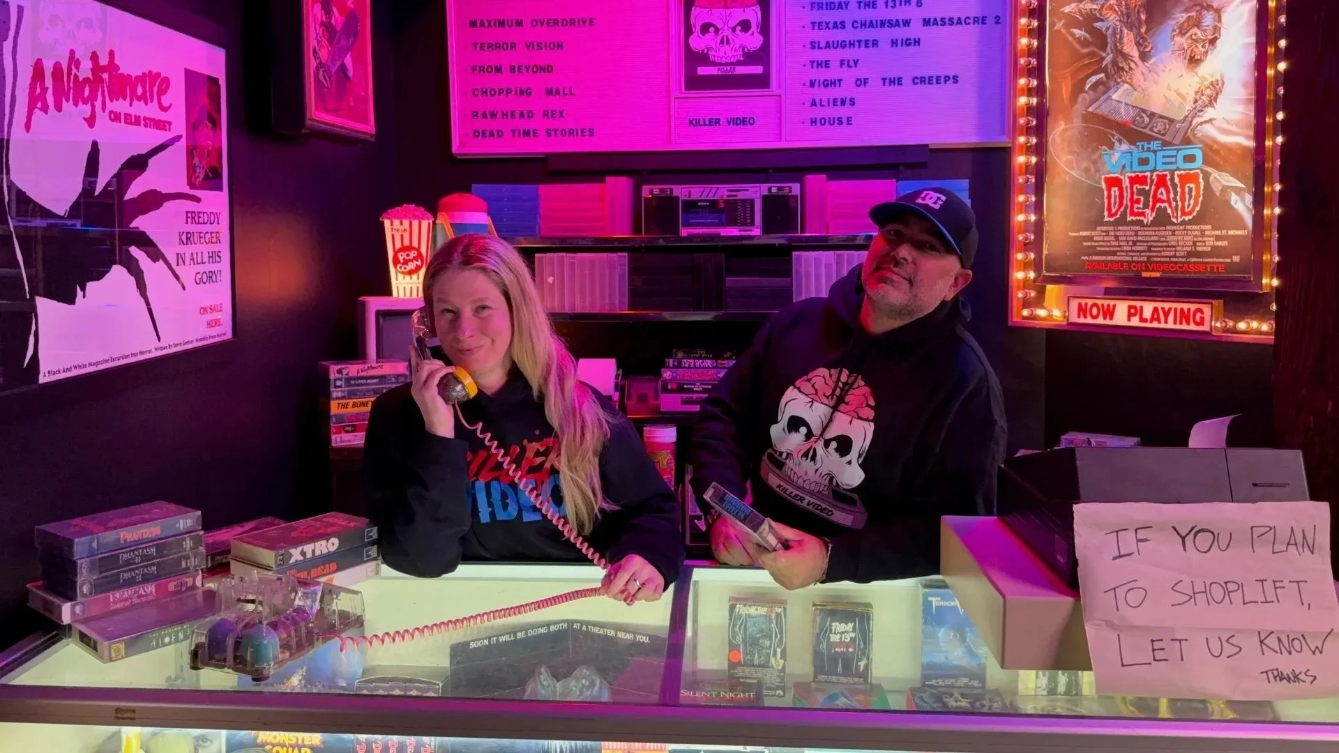 Co-founders Erika Fritz and Jonathon Carmichael stand behind the counter of Killer Video.
