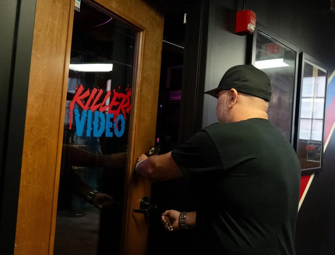 Founder Jonathon Carmichael opens the door the the existing museum space for Killer Video