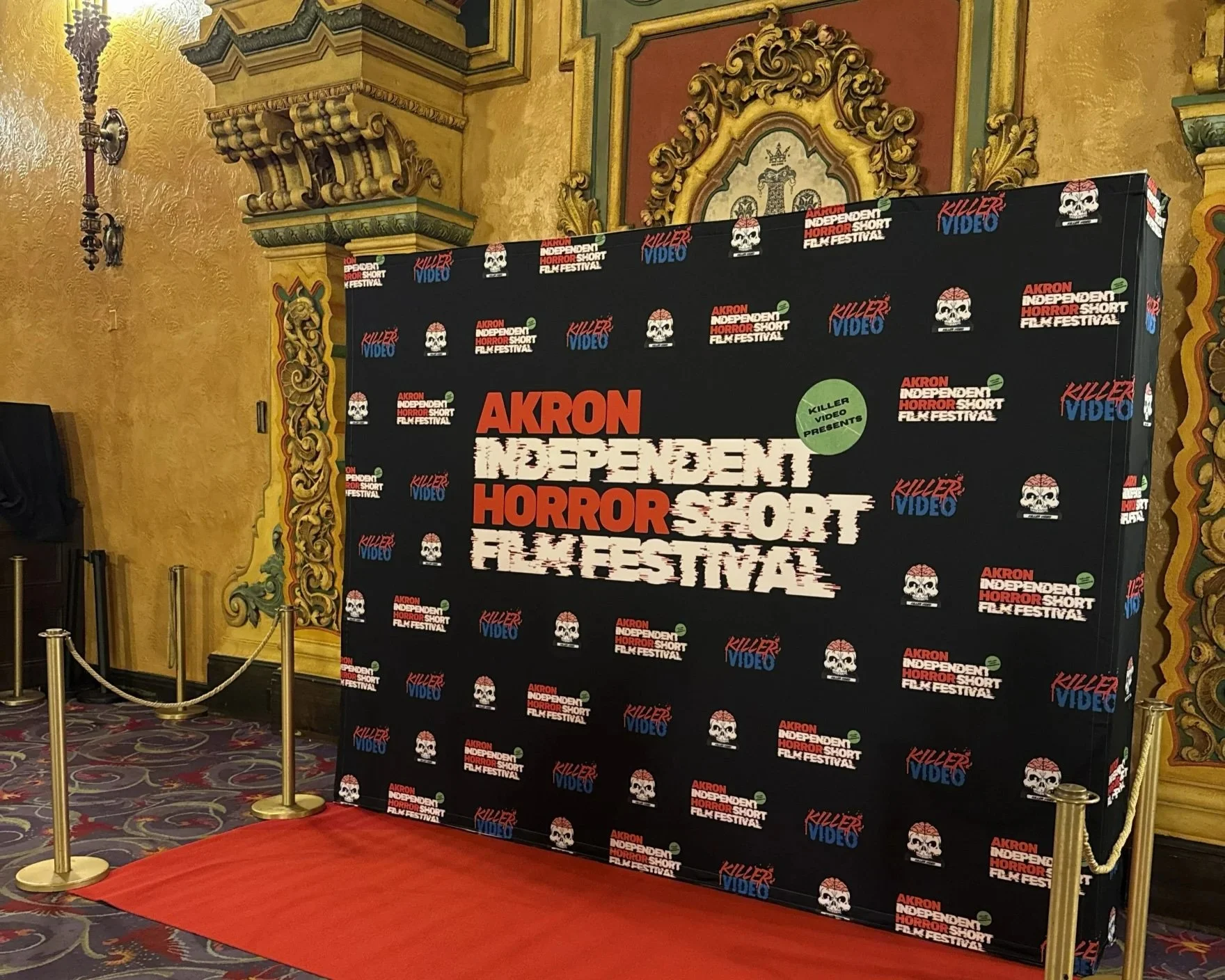 A picture of the Akron Independent Horror Short Film Festival's step-and-repeat at the Akron Civic