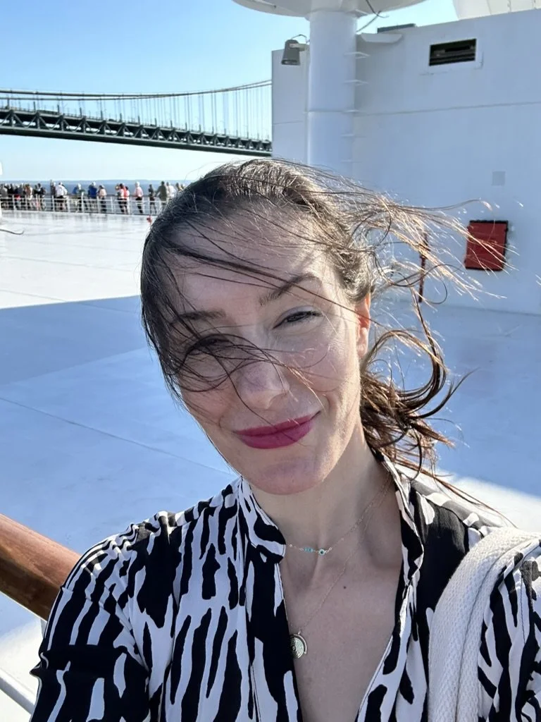 Windblown selfie of Jessica Berg on a ship deck