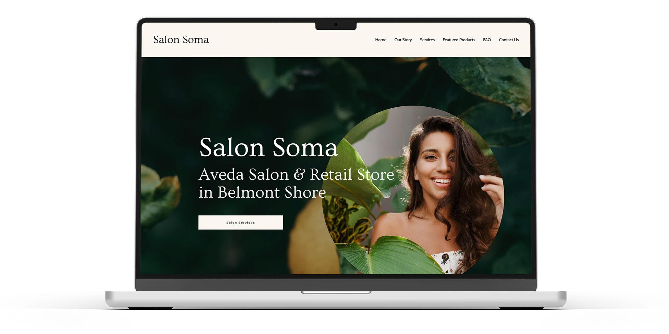 Laptop screen displaying a website for Salon Soma, a hair salon and retail store in Belmont Shore. The page features a smiling woman with long, wavy brown hair, surrounded by green leaves, with a navigation menu at the top and a button labeled 'Salon Services'.
