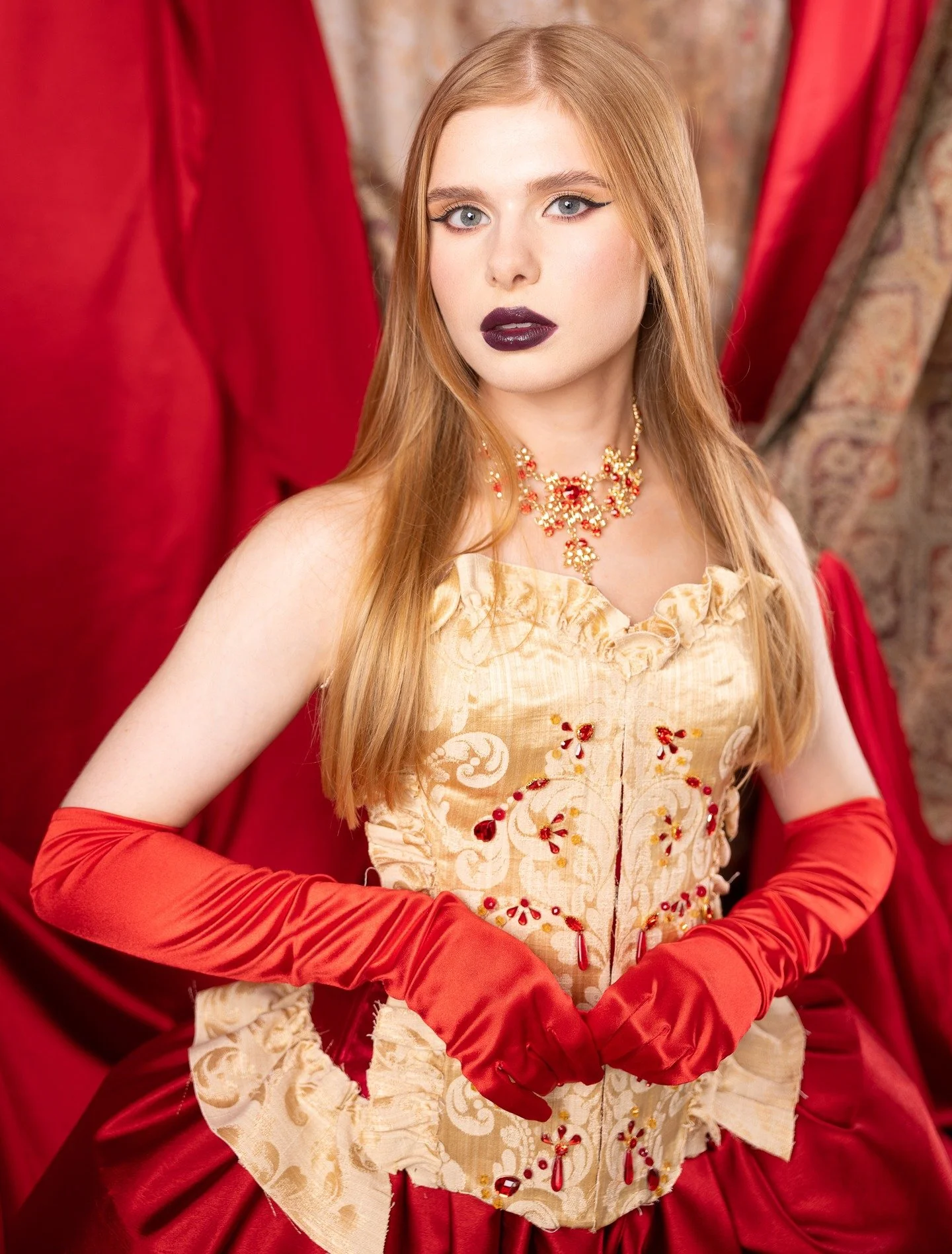 Stepping into the frame like she owns the entire era. Rich reds, gold detailing, and a presence that doesn&rsquo;t need anything more than stillness. @charlotemodel delivered this look with absolute precision today. Absolutely flawless! 

#portraitph