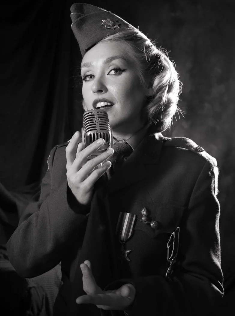A borrowed uniform, a borrowed stage, and a voice carrying through the dark. Somewhere in 1943, someone is listening. 

@eloisehare 
@lisavetamua 
@studioluminescence 

#VintagePortraiture #StudioLighting #1940sStyle #WartimeNostalgia #BlackAndWhiteP