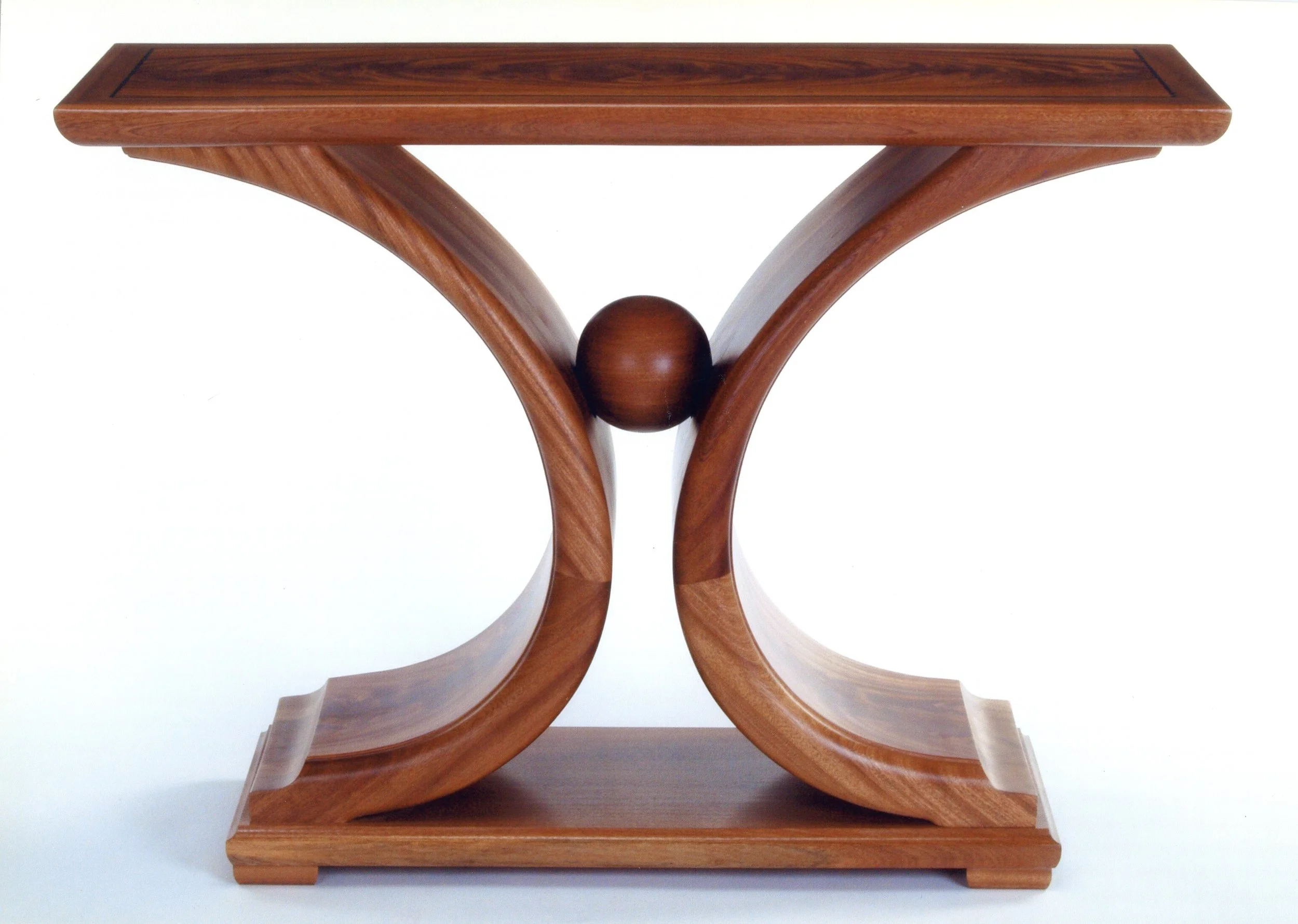 Wooden console table with curved legs and a central spherical ornament.