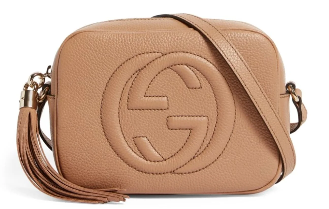 A beige Gucci Soho bag.
